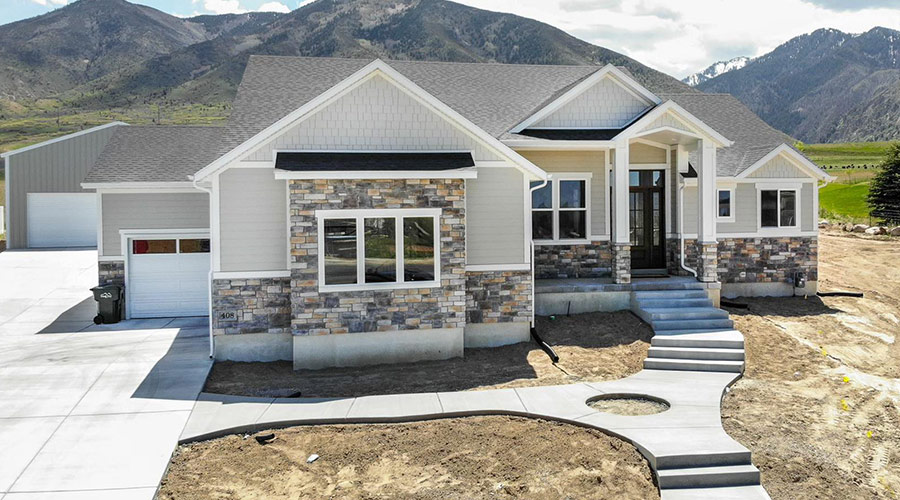 front-exterior-of-new-home-with-mountains-behind-tooele-ut