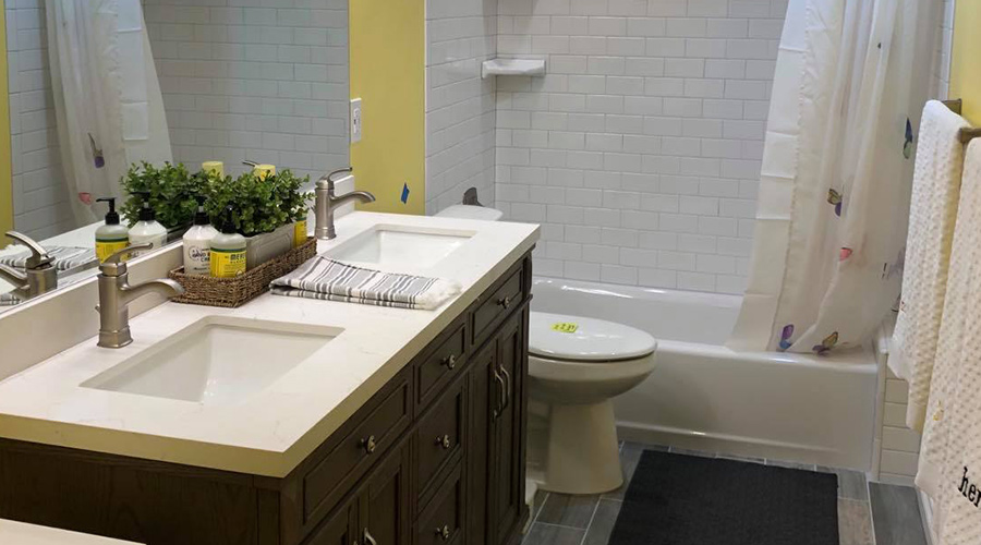 bathroom-with-brown-vanity-with-two-sinks-tooele-ut
