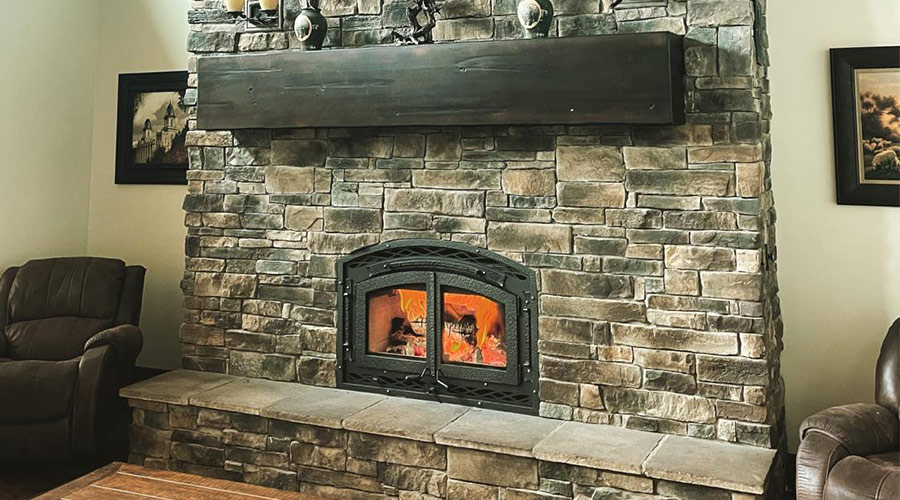 small-fireplace-in-karge-stone-wall-in-living-room-tooele-ut